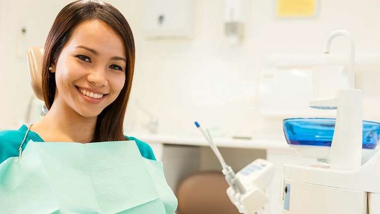 Woman Smiling at Dentist Woman Smiling at Dentist