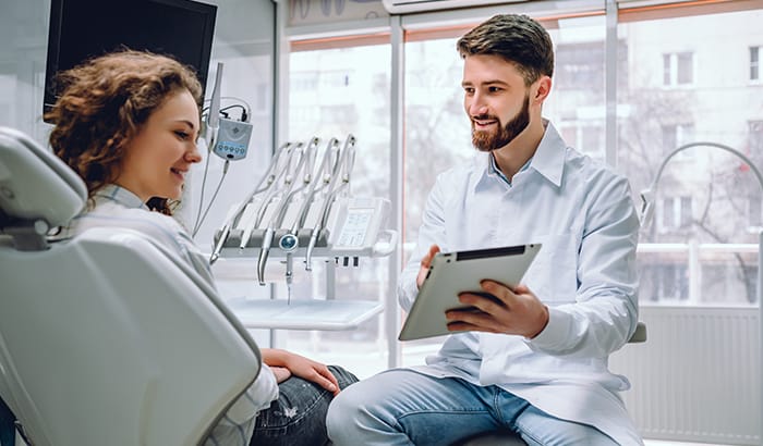 Patient consulting with dentist about finding a new dental provider Patient consulting with dentist about finding a new dental provider