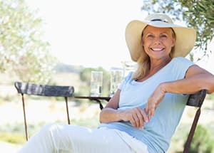 Happy woman enjoying the outdoors while maintaining dental hygiene during camping Happy woman enjoying the outdoors while maintaining dental hygiene during camping