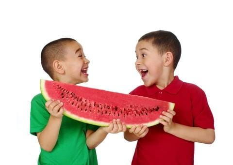 Kids sharing Watermelon Kids sharing Watermelon