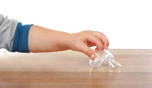 Reaching for a pacifier