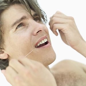 Flossing cleans areas that the toothbrush misses