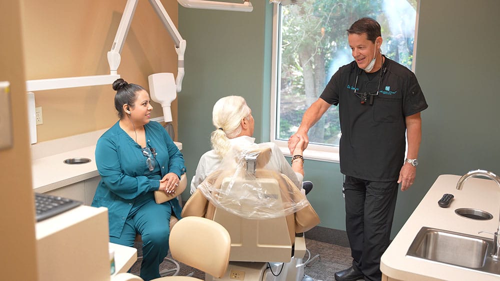 Dr. Domingoes with assistant and patient