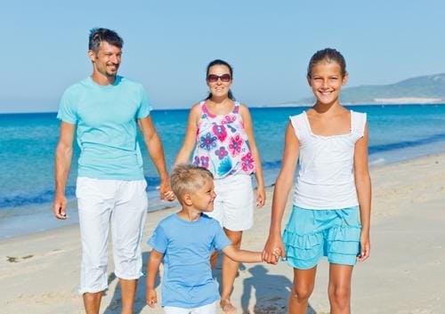 Family smiling at the Beach Family smiling at the Beach