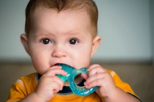 Baby with teething ring