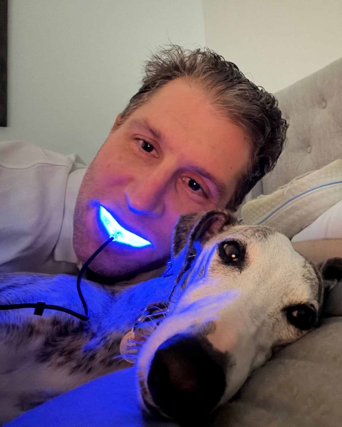 Dr. Andrew doing some GLO whitening with a little puppy supervision