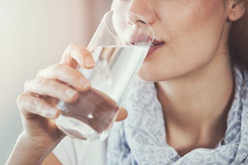 Woman Drinking Tap Water