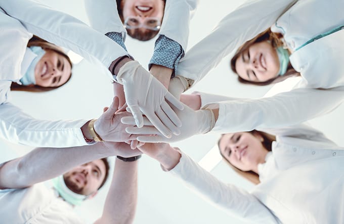 Dental Team Hands Together