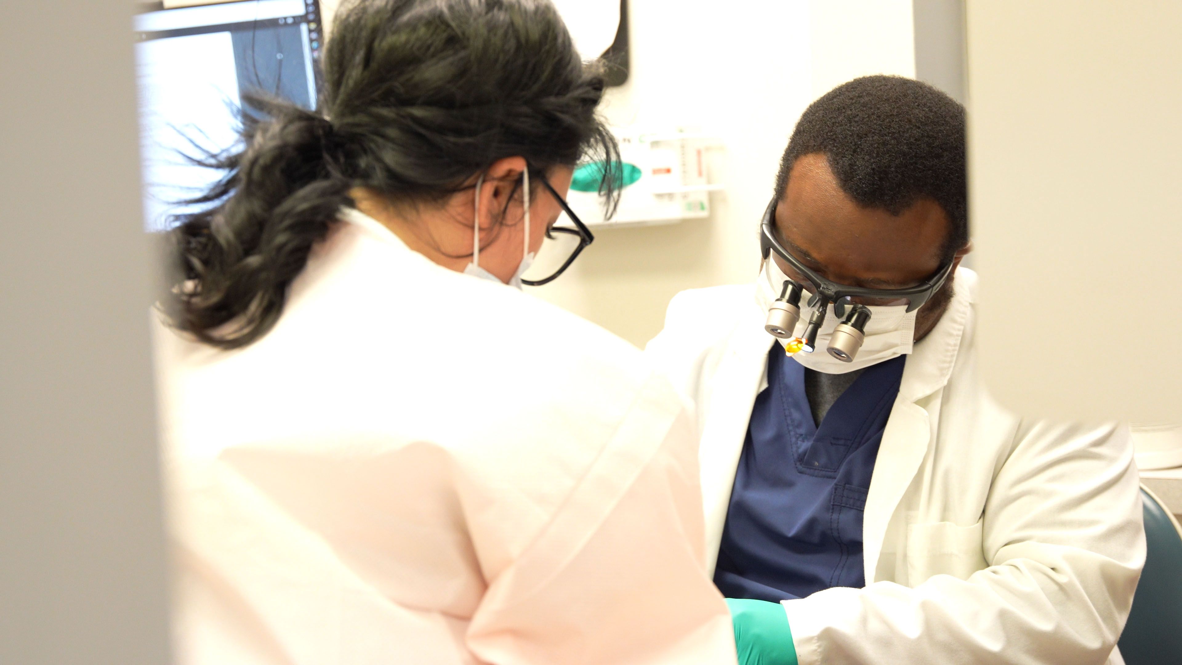 Dr. Nicholas A. Moore, DDS performing a dental filling