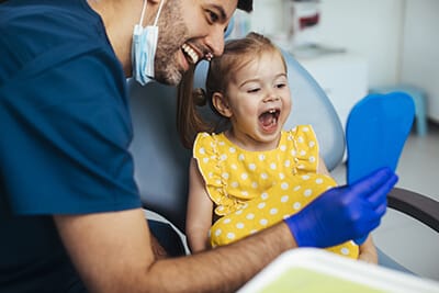 Pediatric dentist career young girl smiling
