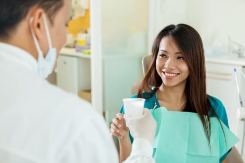 Dental patient with water cup
