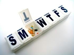 Weekly pill organizer containing probiotic supplements for dental health