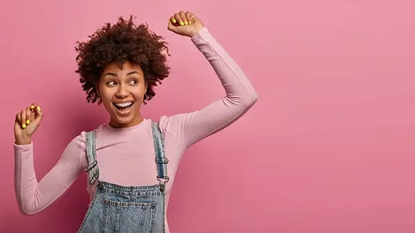 Smiling woman representing healthy teeth from eating crunchy produce snacks