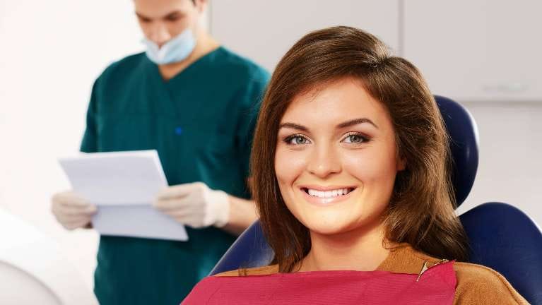 Woman Smiling at Dentist Woman Smiling at Dentist