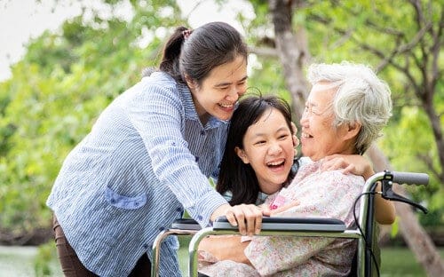 Grandmother with daughters smiling