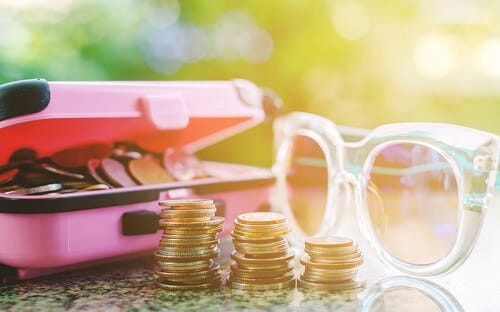 Vacation coins and sunglasses