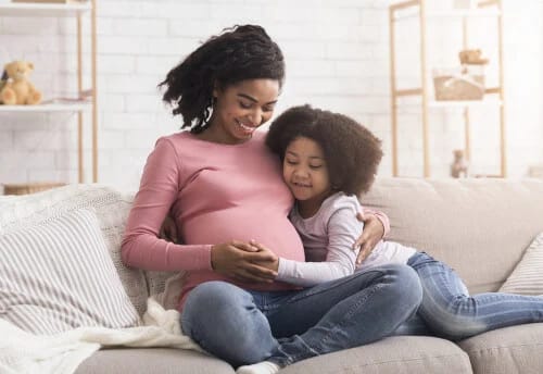 Pregnant mom with daughter