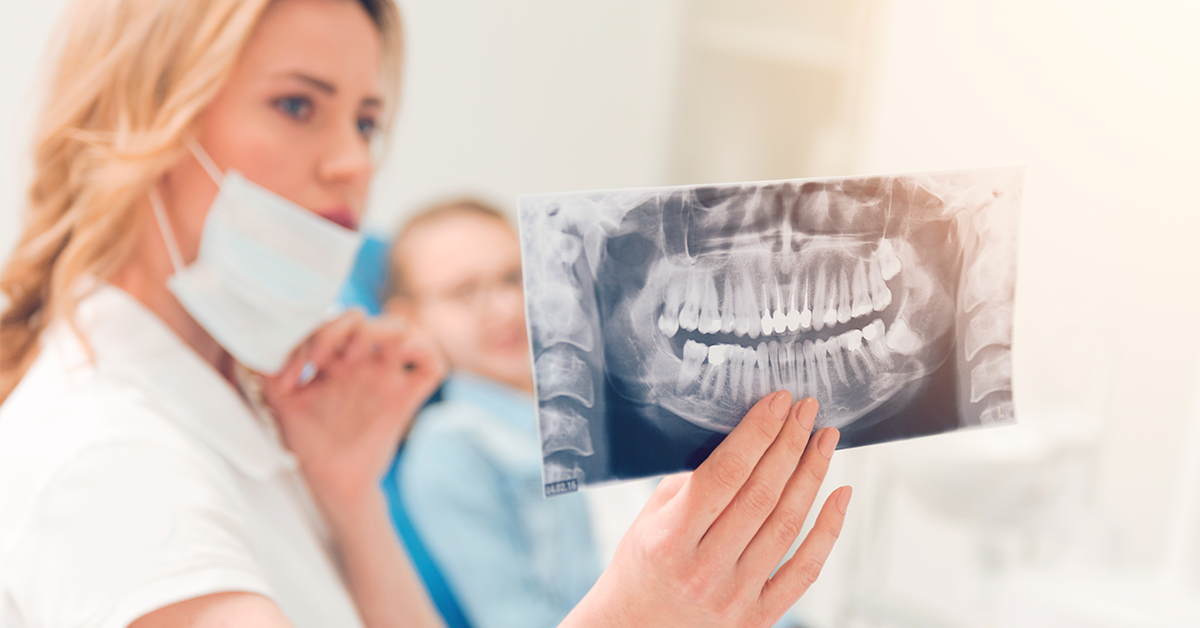 endodontist explaining procedure to patient